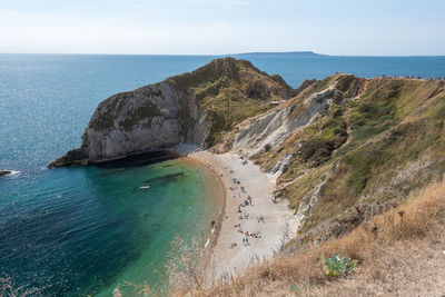 High angle view of sea shore against sky