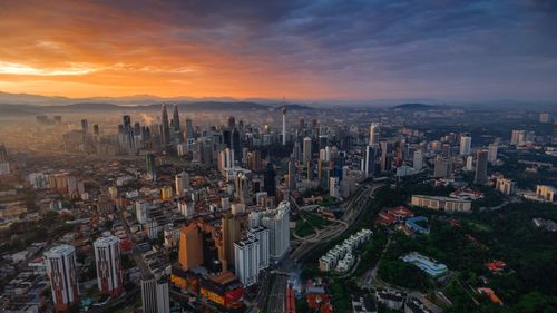 High angle view of city at sunset