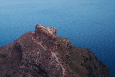 High angle view of rock formation in sea