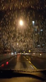 Cars on road seen through car windshield