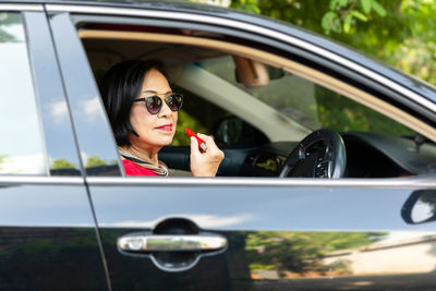 Portrait of woman in car