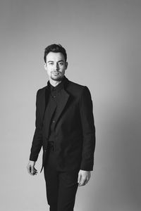 Portrait of a young man against white background