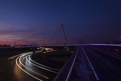 Illuminated bridge against sky