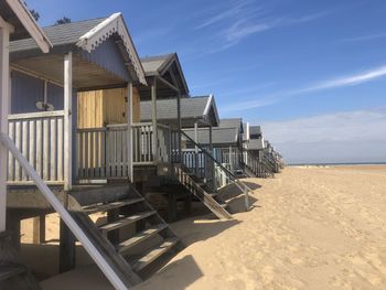 Built structure on beach against sky