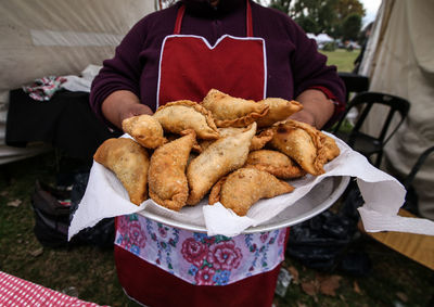 Midsection of man holding food