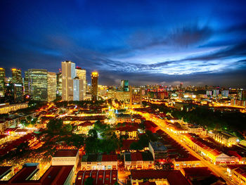 Aerial view of city lit up at night