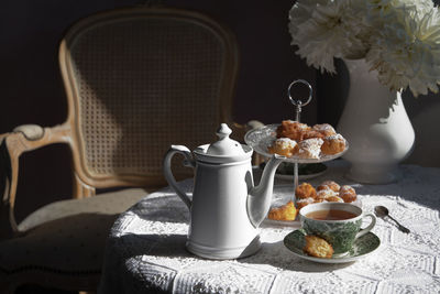 Tea break in english style, vintage still life, homemade buns, a bouquet dalias