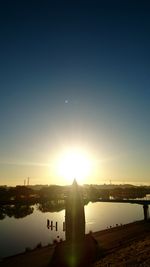 Scenic view of river at sunset