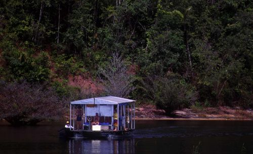 Men on boat over lake