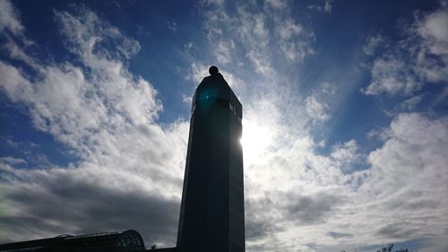 Low angle view of statue against cloudy sky