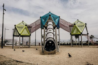 Built structure on beach against sky