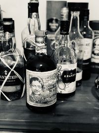 Close-up of wine bottles on table