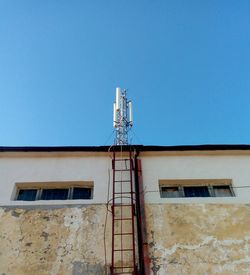 Low angle view of building against clear blue sky