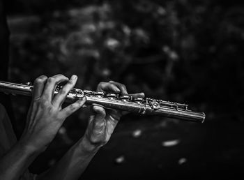 Cropped hands playing flute