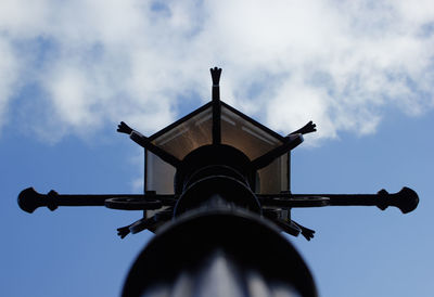 Low angle view of street lighting against sky