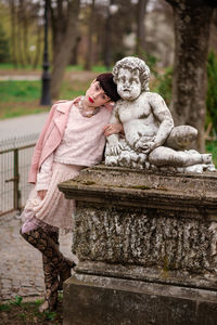 Portrait of woman with sculpture