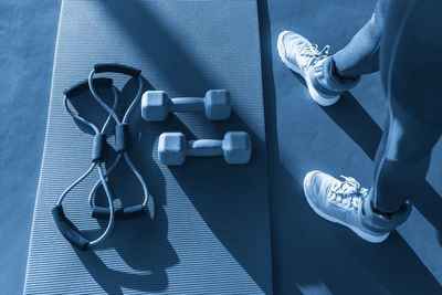 Low section of woman exercising in gym