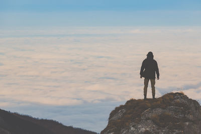 Rear view of man looking at cloudscape