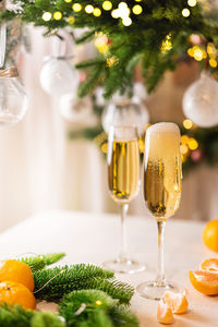 Close-up of wine glasses on table