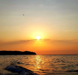 Scenic view of sea against sky during sunset