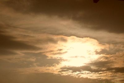 Low angle view of cloudy sky at sunset