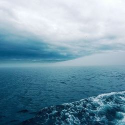 Scenic view of sea against cloudy sky