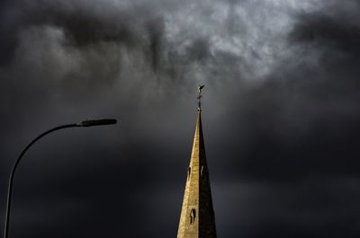 Low angle view of windmill against sky at night