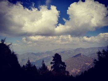 Scenic view of silhouette mountains against sky