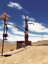 Bunting flags on arid landscape against blue sky