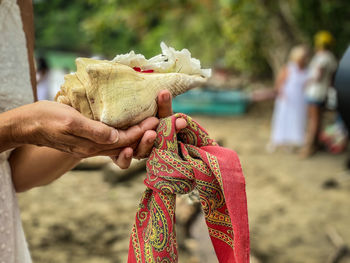 Shell with mexican handkerchief ready for a ceremony and ritual of ashes of woman  to caribean sea.  