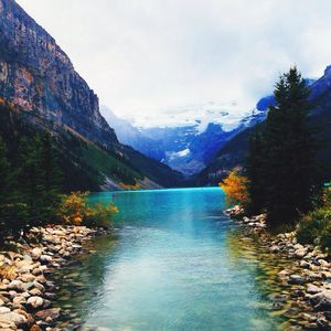 Scenic view of lake against cloudy sky