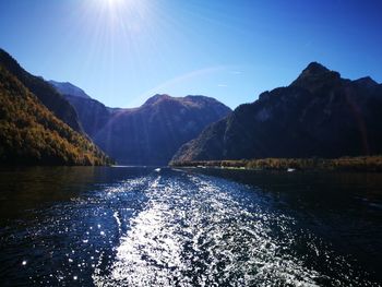 Scenic view of lake and mountains against sky