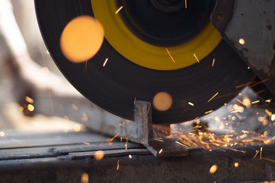 Closeup of circular grinder cutting iron