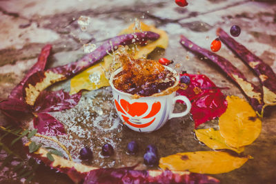 Close-up of coffee splashing from cup on table