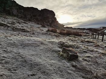 Rock formation on land against sky