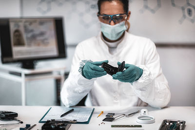 Female scientist working at crime laboratory