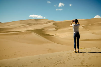 Woman standing on mountain landscape