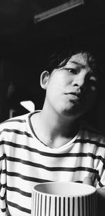 Portrait of young man looking away