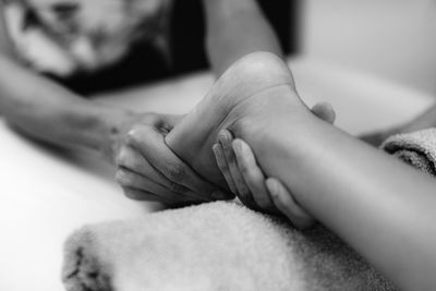 Ayurvedic foot massage. hands of ayurveda practitioner massaging female foot