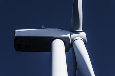 Low angle view of wind turbine against clear sky