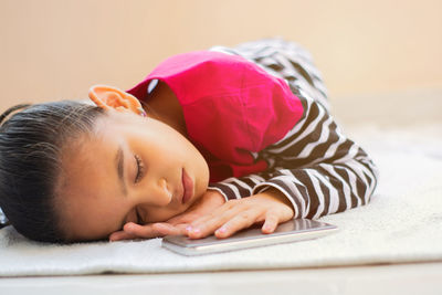 Close-up of woman sleeping on bed