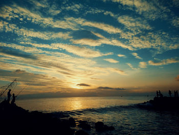 Scenic view of sea against sky at sunset