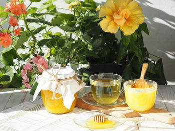 Close-up of yellow flowers in vase on table