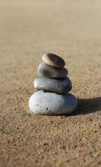 Close-up of stack of pebbles on beach