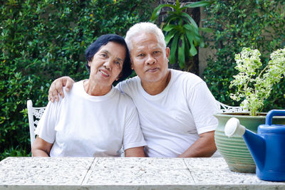 Portrait of a couple sitting outdoors