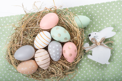 High angle view of eggs in nest on table