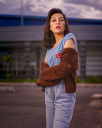 Young girl in the evening scenery. beautiful woman outside the house on a sunny day