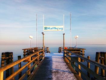 Pier over sea against sky