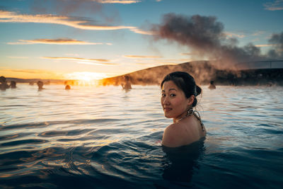 Portrait of woman swimming in sea