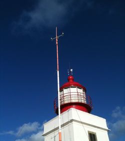 Low angle view of lighthouse against blue sky